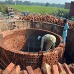 Labourers busy constructing a sewage disposal system at Nadran Bypass as part of ongoing development work