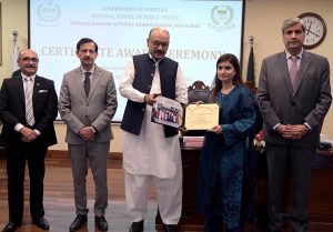 Secretary, Establishment Division, Barrister Nabeel A. Awan presents certificates to participants during the passing-out ceremony of the 47th Mid-Career Management Course at NIPA
