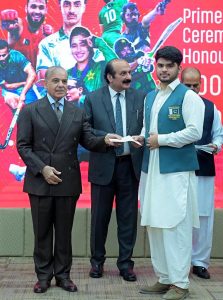 Prime Minister Muhammad Shehbaz Sharif distributes reward cheques amongst the medal winners of the Asian Games