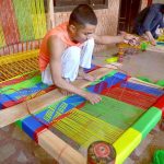 Worker makes a traditional woven bed, known as a Charpai, at a workshop in Dabgari area