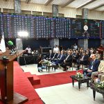 Federal Minister for Finance and Revenue Senator Muhammad Aurangzeb addresses the audience during the gong ceremony marking the listing of NAYA Nazimabad Apartment REIT at the Pakistan Stock Exchange (PSX)