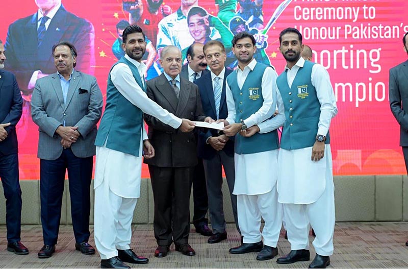 Prime Minister Muhammad Shehbaz Sharif distributes reward cheques amongst the medal winners of the Asian Games