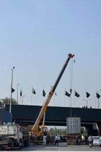 A crane lifts a container as authorities remove containers from the entry and exit routes of Federal Capital, on the administration’s orders.