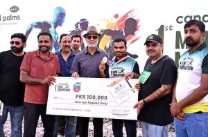 Chairman South Asian Athletics Federation Major General (R) Muhammad Akram Sahi distributes prizes during the Sargodha First Mini Marathon Race 2026
