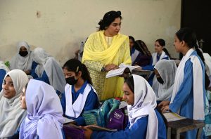 A teacher performs her duties at a government school as the world observes World Teachers’ Day, highlighting the vital role of teachers in education and the development of society.