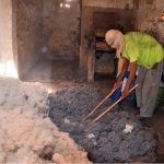 A labourer arranges cotton for making filling quilts ahead of the winter season at his workplace