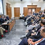 Federal Minister for Finance and Revenue Senator Muhammad Aurangzeb addresses a meeting at the Overseas Investors Chamber of Commerce and Industry (OICCI) office
