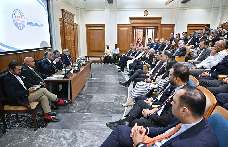 Report: Federal Minister for Finance and Revenue Senator Muhammad Aurangzeb addresses a meeting at the Overseas Investors Chamber of Commerce and Industry (OICCI) office