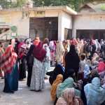 A large number of women wait to register for the Benazir Income Support Programme (BISP) in Latifabad