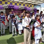 Head of The City School University Town Campus Mariam Khalid administers the oath to students during an investiture ceremony at the campus in the city