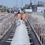 Workers install drainage pipes along Ring Road as part of ongoing development work to improve the city’s drainage system