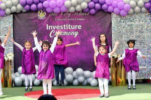 Head of The City School University Town Campus Mariam Khalid administers the oath to students during an investiture ceremony at the campus in the city