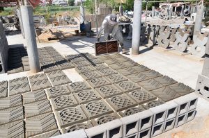 A labourer preparing cement mesh at his work place near Hala naka road.