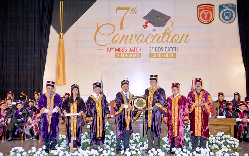 Prof. Dr. Rashid Latif Khan, Vice Chancellor of RLKU, presents a shield to Federal Minister for Planning, Development and Special Initiatives Ahsan Iqbal during the 7th convocation ceremony at Rashid Latif Medical and Dental College