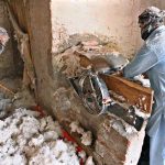 A worker prepares cotton at his workplace to fill quilts in the Factory Area