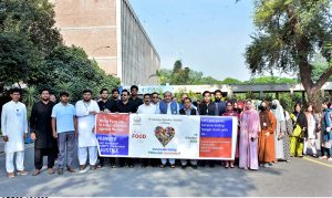 Faculty members and students of the University of Agriculture Faisalabad participate in a walk to mark World Food Day, organized by the National Institute of Food Science and Technology (NIFSAT), Faculty of Food, Nutrition and Home Sciences University of Agriculture Faisalabad (UAF)-
