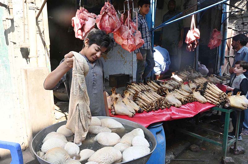 A young vendor is selling goat heads and trotters at his shop in the Provincial Capital