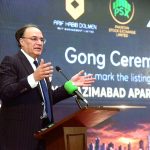 Federal Minister for Finance and Revenue, Senator Muhammad Aurangzeb addressing the Gong Ceremony organized by Arif Habib Corporation at the Pakistan Stock Exchange (PSX) to mark the listing of Naya Nazimabad Apartments REIT