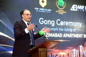 Federal Minister for Finance and Revenue, Senator Muhammad Aurangzeb addressing the Gong Ceremony organized by Arif Habib Corporation at the Pakistan Stock Exchange (PSX) to mark the listing of Naya Nazimabad Apartments REIT