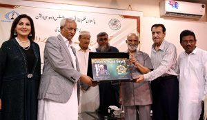 Senior journalist Mehmood Sham administers the oath to newly elected office-bearers of the Pakistan Film and TV Journalists Association at the Karachi Press Club. Sindh Governor Nehal Hashmi is also present on the occasion.