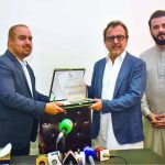 Qasim Butt, Head of the Sardar Farooq Ahmed Khan Leghari Airport Expansion Project, presenting a shield to Federal Minister for Energy Sardar Awais Ahmed Khan Leghari