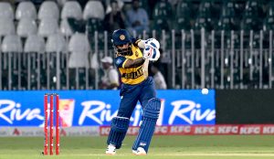 Cricket teams of Pakistan and Sri Lanka stand at attention as their national anthems are played before the start of the T20 International cricket match between the two sides at Rawalpindi Cricket Stadium.