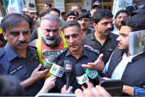 Capital City Police Officer (CCPO) Dr. Mian Saeed inspects the collapsed school building during a visit to Dir Colony.