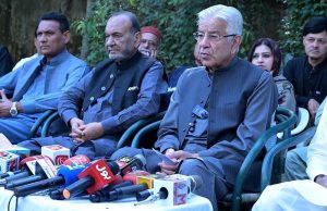 Defence Minister Khawaja Muhammad Asif talking to media persons at his liaison office in the Cantt area