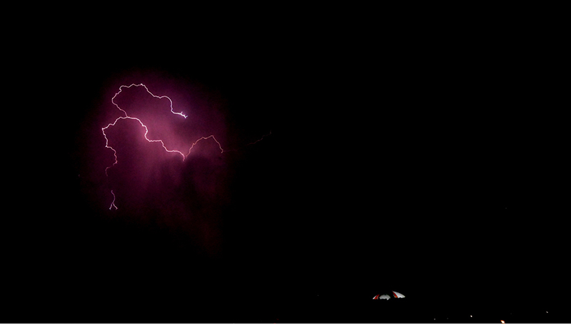 An attractive view of the lighting over the Pakistan Monument as dark clouds hover over the federal capital in the evening