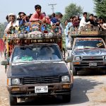 A large number of passengers traveling on the rooftop of vans at Fatehpur Mirani village Road may cause any mishap and needs the attention of concerned authorities