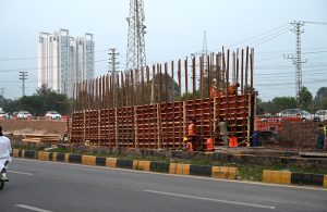 Workers are engaged in construction work on the underway Kashmir Chowk Underpass (Dhokri Chowk) project along Murree Road in the Federal Capital.