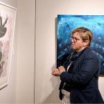 A visitor view the group painting exhibition of 40 artists with "THRESHOLD" at Arfiras Art Gallery