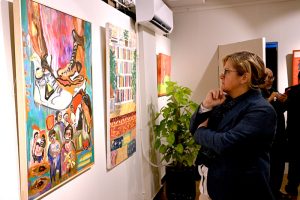 A visitor view the group painting exhibition of 40 artists with "THRESHOLD" at Arfiras Art Gallery