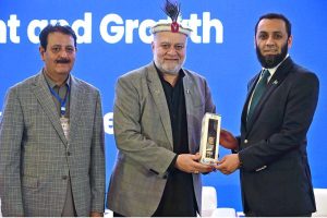 Federal Minister for Poverty Alleviation and Social Safety, Syed Imran Ahmed Shah presenting gift to Federal Minister for Information and Broadcasting, Attaullah Tarar during the International Conference on "Inclusive and Resilient Economic Empowerment and Growth" organized by Pakistan Poverty Alleviation Fund (PPAF) at local hotel