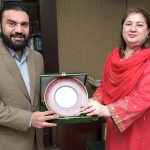 Acting MD, Associated Press of Pakistan(APP), Sabeen Usman Khattak presenting a souvenir to Executive Director Higher Education Commission, Pro Dr Zia Ul Haq during his visit to APP Headquarters