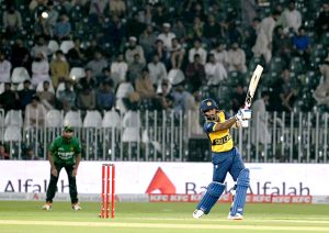 Sri Lankan batter Lahiru Udara plays a shot during the T20 cricket match between Pakistan and Sri Lanka at Rawalpindi Cricket Stadium.