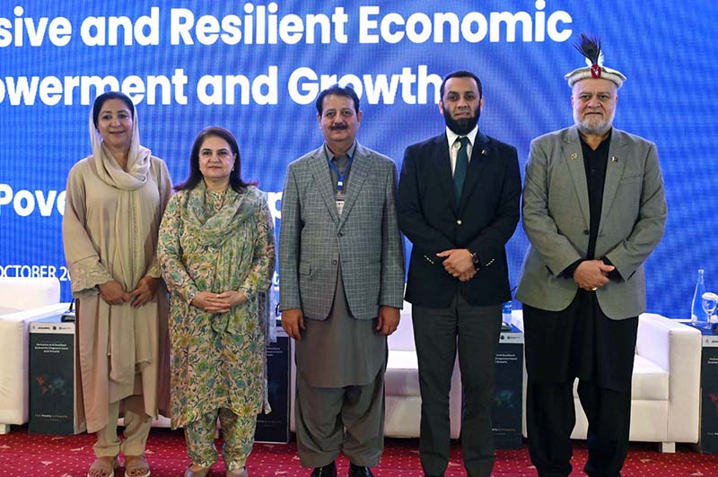 Federal Minister for Information and Broadcasting, Attaullah Tarar in a group photograph during the International Conference on "Inclusive and Resilient Economic Empowerment and Growth" organized by Pakistan Poverty Alleviation Fund (PPAF) at local hotel
