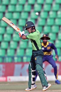 Pakistani batsman Maaz Sadaqat batter plays a shot during the ODI tri-series cricket match against Sri Lanka at Gaddafi Stadium.