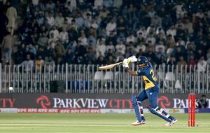 Sri Lankan batter Lahiru Udara plays a shot during the T20 cricket match between Pakistan and Sri Lanka at Rawalpindi Cricket Stadium.