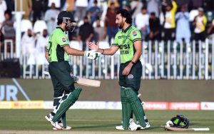 Pakistani batter Salman Ali Agha celebrates after scoring a century during the ODI Tri-Nation Series match between Pakistan and Sri Lanka at Rawalpindi Cricket Stadium