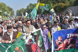 Governor of Khyber Pakhtunkhwa Faisal Karim Kundi addresses participants during a protest marking Kashmir Black Day outside the Governor House.
