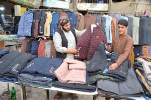 Vendor set up winter coats for customers near main Chowk