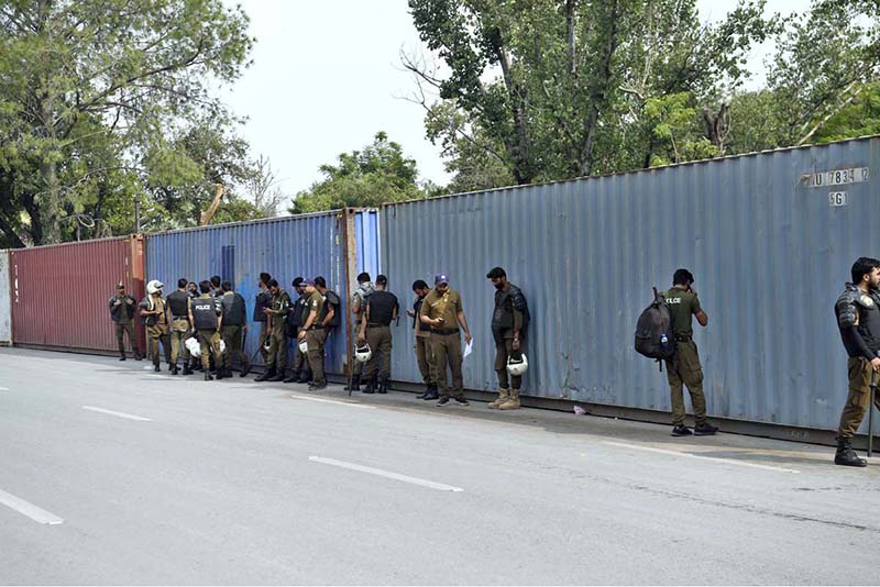 Security officials place containers in Islamabad’s Red Zone, which houses most embassies and government offices, following the imposition of an emergency and governor’s rule in Khyber Pakhtunkhwa, approved by President Asif Ali Zardari, amid heightened tensions between the federal government and the PTI-led provincial administration during the party’s ongoing protest campaign