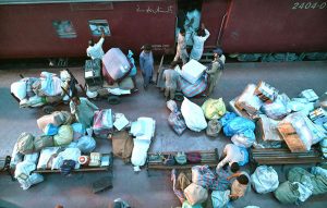 Despite the rise of email, social media and AI, postal services remain an enduring means of communication as workers load mail into a train carriage ahead of World Post Day.