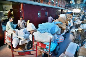 Despite the rise of email, social media and AI, postal services remain an enduring means of communication as workers load mail into a train carriage ahead of World Post Day.