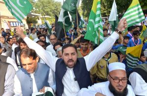 Governor of Khyber Pakhtunkhwa Faisal Karim Kundi addresses participants during a protest marking Kashmir Black Day outside the Governor House.
