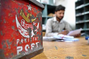 Despite the rise of email, social media and AI, postal services remain an enduring means of communication as workers load mail into a train carriage ahead of World Post Day.