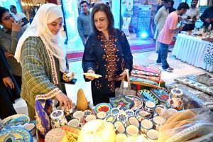 Visitors explore stalls during International Conference on "Inclusive and Resilient Economic Empowerment and Growth" organized by Pakistan Poverty Alleviation Fund (PPAF) at local hotel