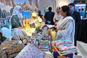 Visitors explore stalls during International Conference on "Inclusive and Resilient Economic Empowerment and Growth" organized by Pakistan Poverty Alleviation Fund (PPAF) at local hotel