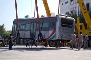 Newly acquired 25 BRT buses are transported by trucks from Karachi Port to the BRT headquarters.